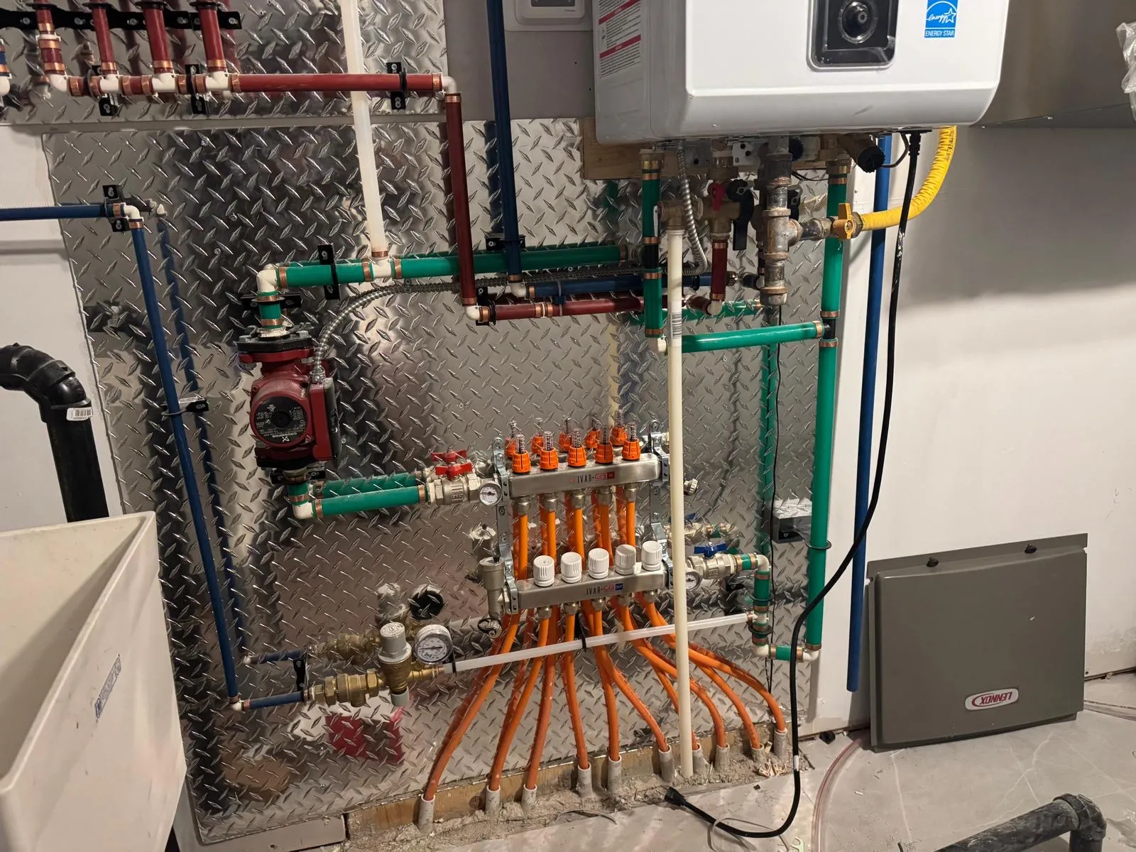 Hydronic boiler manifold with zone valves and copper piping
