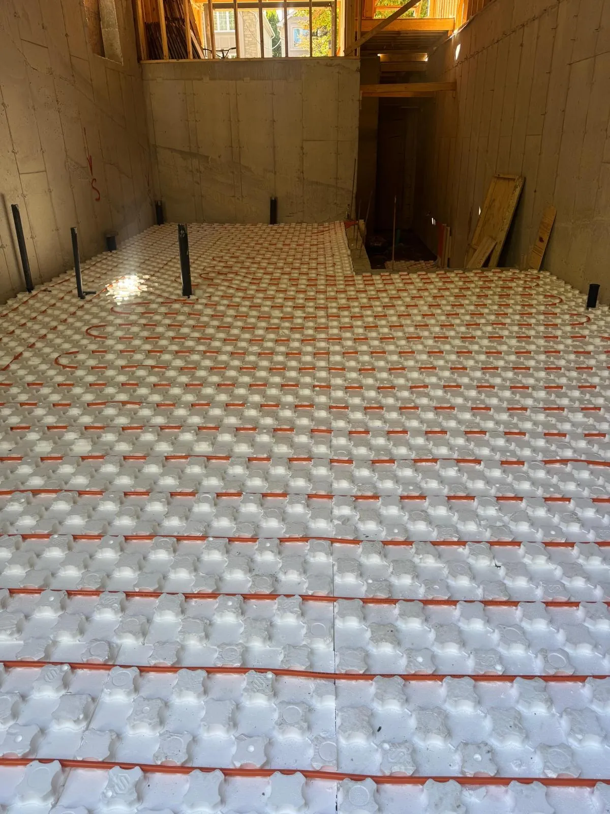In-floor radiant heating tubing laid in a GTA home subfloor