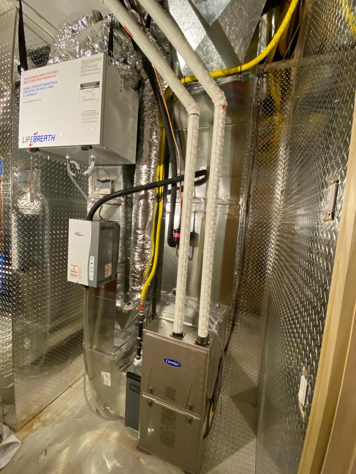 Whole-home humidifier and ductwork in a GTA mechanical room
