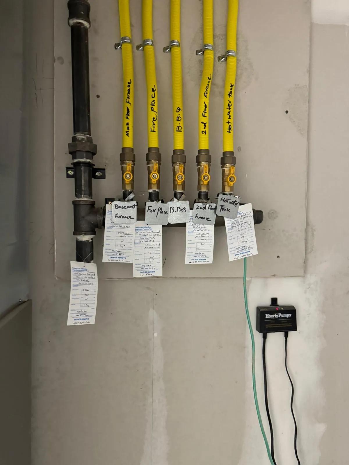 Detail of a hydronic manifold with gas lines and zone valves